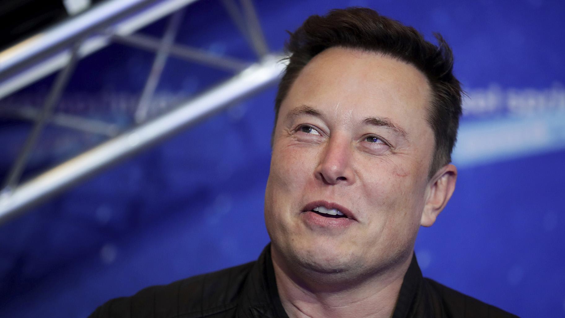 Tesla and SpaceX CEO Elon Musk arrives on the red carpet for the Axel Springer media award in Berlin on Dec. 1, 2020. (Hannibal Hanschke /Pool Photo via AP, File)